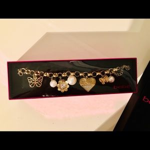Bebe BRAND NEW Gold Charm Bracelet